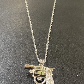 Glow in the dark gun necklace